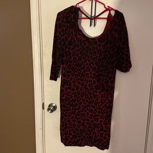 Leopard red sweater dress. Looks good with tall boots.